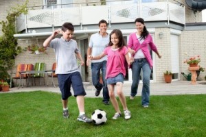 family-playing-soccer